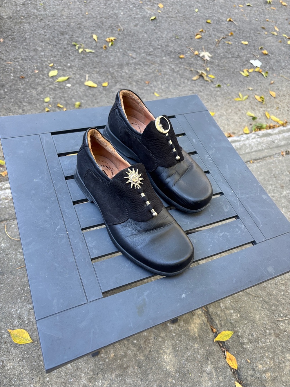Think! Women's Black Leather Slip-On Flats with Gold Sun & Moon Accents